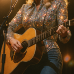 country western singer woman wearing rhinestone jacket